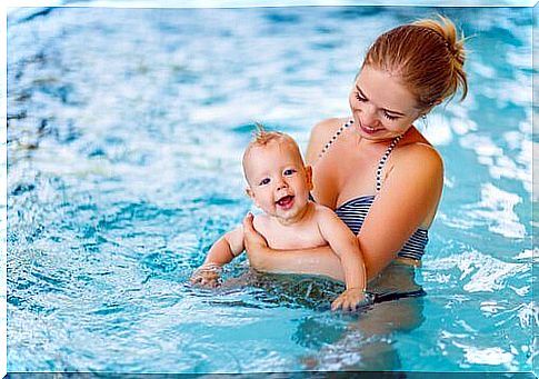 mother and baby in the pool