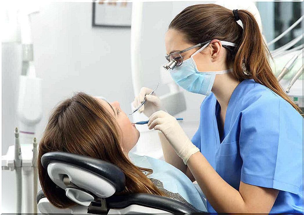 A pregnant woman at a dental appointment.