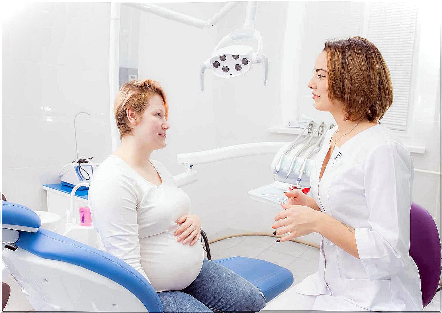 A pregnant woman at the dentist's office.