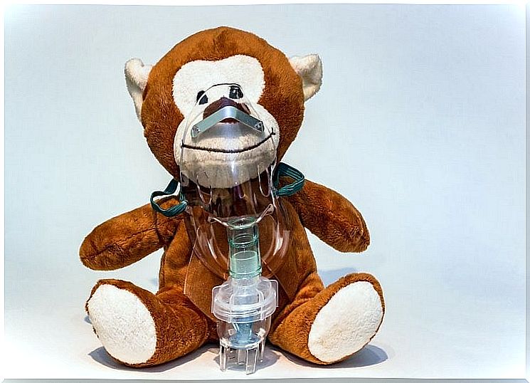 Toy bear with oxygen mask