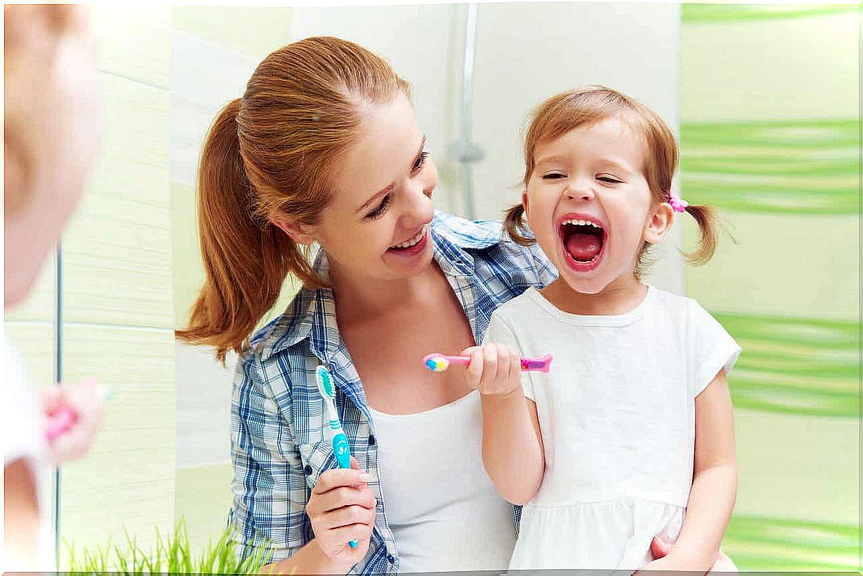 Family brushing their teeth.