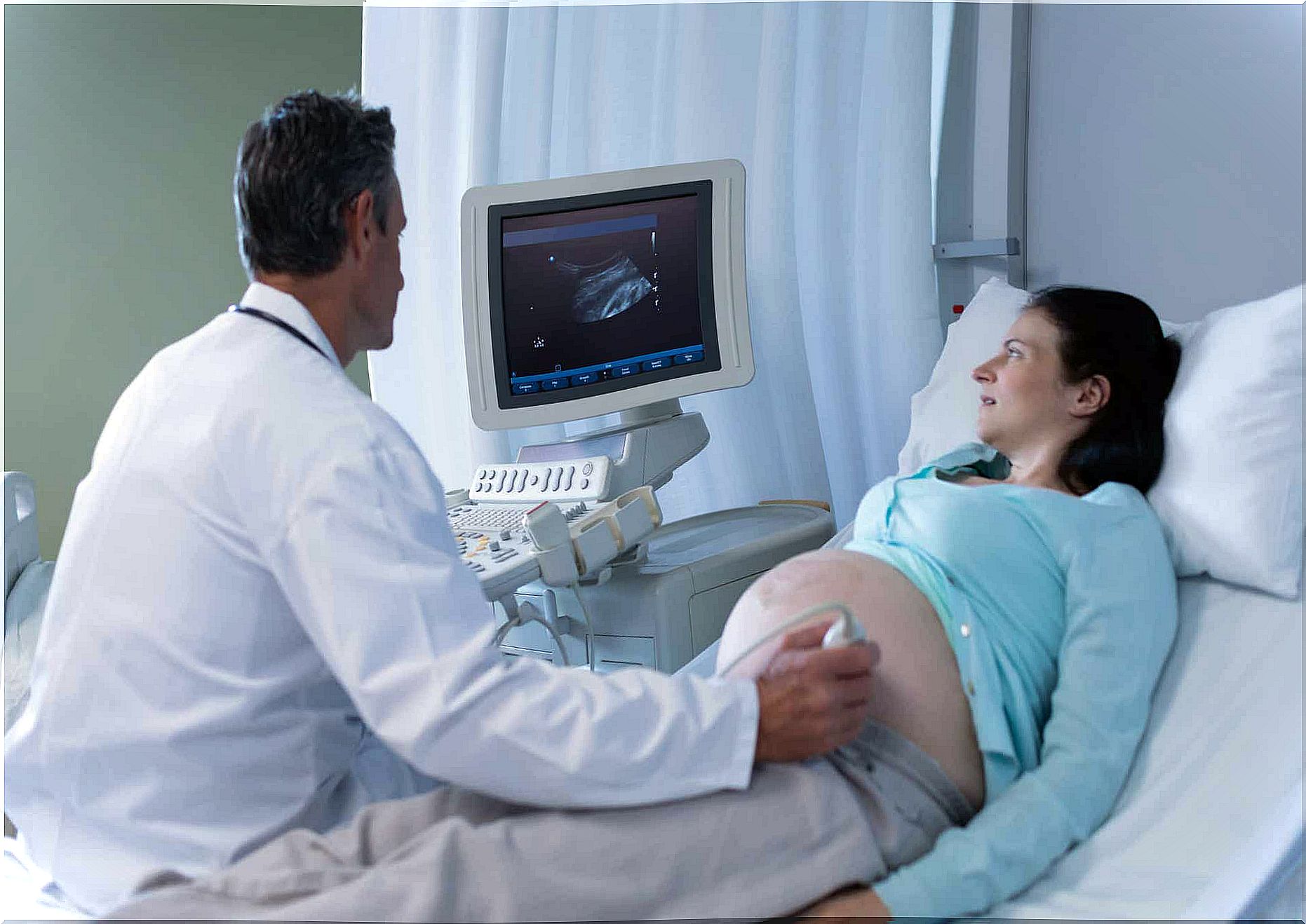 A mother in her final weeks of pregnancy getting an ultrasound to check on her baby's lung development