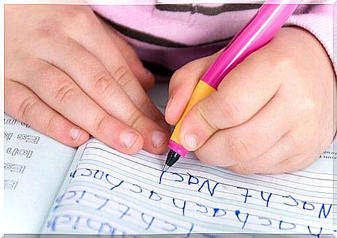 A young girl learning to write.