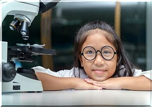 Girl at a microscope