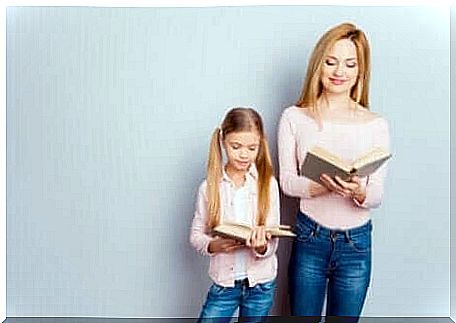 Mother and daughter reading a book