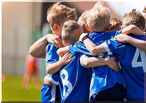 Children in a blue sports outfit