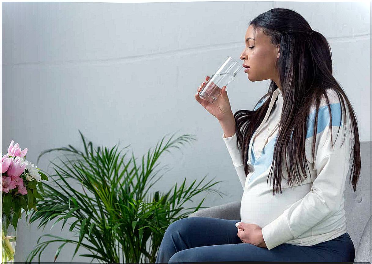 Woman drinking water.