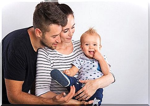 parents carry their baby