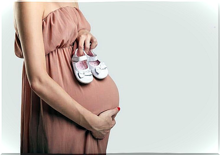 Pregnant woman in strapless dress