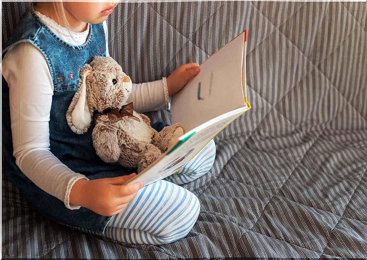 Girl reading a book.