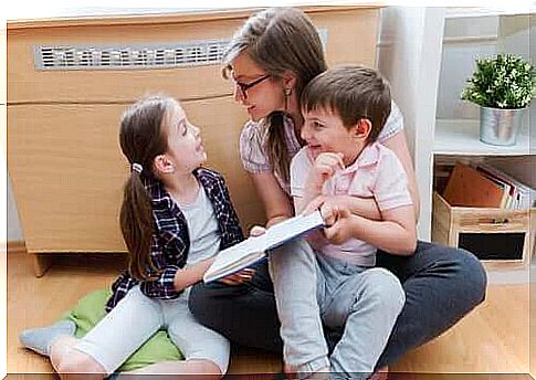 Mother and children talking about book