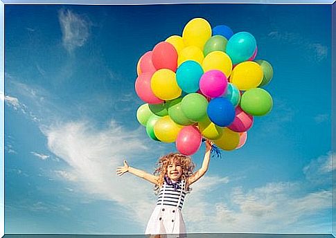 Happy girl with balloons