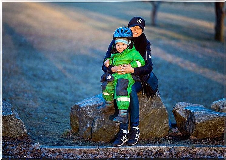 Aunt and child on a stone