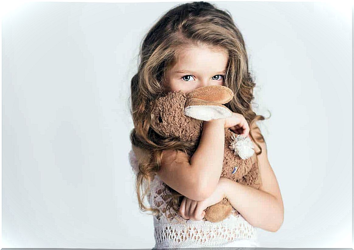 A girl with soft toy.